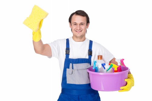 Carpet cleaning team using protective measures in a home